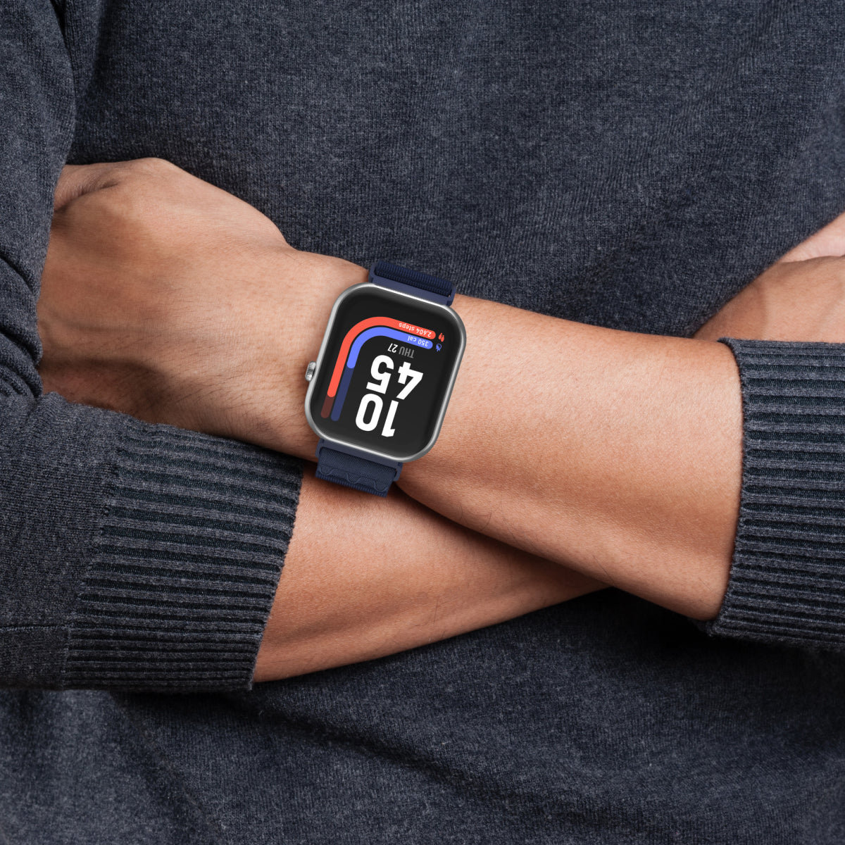 Smartwatch on a person's wrist with a dark gray sweater